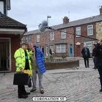 PHD's cover coat on set with the cast of Coronation Street