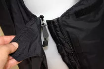 Side zips undo fully (at the top). No need to remove boots/crampons.